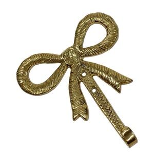 Vintage brass wall hook shaped as a ribbon bow